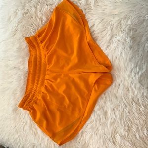 Orange lululemon hotty hot shorts